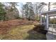 Expansive backyard with mature trees and a tranquil setting by the screened porch at 513 Princeton St, Raleigh, NC 27609