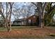 Inviting brick home with a cozy front porch and beautiful trees at 513 Princeton St, Raleigh, NC 27609