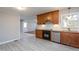 Bright and spacious kitchen with stainless steel appliances, light countertops, and vinyl flooring at 513 Princeton St, Raleigh, NC 27609