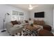 Bright living room with a comfortable sofa, stylish rug, and modern decor creating an inviting atmosphere at 513 Princeton St, Raleigh, NC 27609