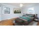 Bedroom with hardwood floors and serene decor providing a cozy, modern, and inviting space at 513 Princeton St, Raleigh, NC 27609