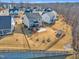 Aerial view of the house, fenced backyard with a shed and playset, surrounded by a well-maintained lawn at 525 Marion Hills Way, Knightdale, NC 27545
