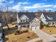 Aerial view of a two-story home showcasing a well-manicured lawn, and a two car garage at 525 Marion Hills Way, Knightdale, NC 27545