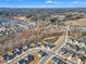 High aerial view of the new construction development and neighborhood surrounding a pond at 525 Marion Hills Way, Knightdale, NC 27545
