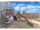 Backyard view featuring an elevated deck with outdoor seating, a swing set, and a lush lawn at 525 Marion Hills Way, Knightdale, NC 27545