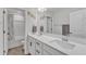 Bright bathroom features double sinks with a large mirror and a shower and bath combination at 525 Marion Hills Way, Knightdale, NC 27545