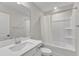 This bathroom features a vanity with solid surface countertop and a shower with bathtub at 525 Marion Hills Way, Knightdale, NC 27545