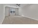 Spacious bedroom features carpet flooring, ceiling fan, recessed lighting, and a large window at 525 Marion Hills Way, Knightdale, NC 27545
