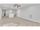 This bedroom boasts neutral walls, carpet flooring, a ceiling fan, and convenient access to adjacent rooms at 525 Marion Hills Way, Knightdale, NC 27545