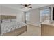Bedroom features two windows, neutral paint, carpet and a bed with grey and white patterned bedding at 525 Marion Hills Way, Knightdale, NC 27545
