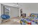 Bedroom with a blue chair, ceiling fan, and carpet at 525 Marion Hills Way, Knightdale, NC 27545
