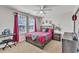 Bright bedroom featuring a ceiling fan, and two large windows with views at 525 Marion Hills Way, Knightdale, NC 27545