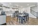 Bright dining area and modern kitchen with stainless steel appliances offer a perfect space for dining and entertaining at 525 Marion Hills Way, Knightdale, NC 27545