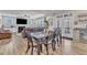 Open concept dining area with view to living room and outdoor access, creating a spacious and bright area for gathering at 525 Marion Hills Way, Knightdale, NC 27545