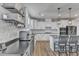 Bright kitchen featuring white cabinets, gray countertops, and stainless steel appliances at 525 Marion Hills Way, Knightdale, NC 27545