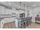 Elegant kitchen with a central island, pendant lighting, and modern appliances at 525 Marion Hills Way, Knightdale, NC 27545