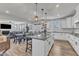 Open-concept kitchen with island seating and a view of the dining and living areas at 525 Marion Hills Way, Knightdale, NC 27545