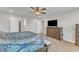 Bright main bedroom with modern ceiling fan and large windows at 525 Marion Hills Way, Knightdale, NC 27545