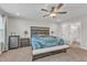 Spacious main bedroom featuring large windows, ceiling fan, and neutral carpet at 525 Marion Hills Way, Knightdale, NC 27545