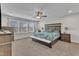 Spacious main bedroom featuring large windows, ceiling fan, and neutral carpet at 525 Marion Hills Way, Knightdale, NC 27545