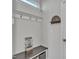 Welcoming mudroom entry with a coat rack, seating, and decor at 525 Marion Hills Way, Knightdale, NC 27545