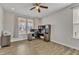 Bright home office with wood floors, a ceiling fan, and a functional workspace at 525 Marion Hills Way, Knightdale, NC 27545