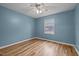 Cozy bedroom with hardwood floors and a ceiling fan at 582 Pollyanna Rd, Henderson, NC 27537