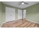 Bedroom features wood-look flooring, closet space, and serene lighting for a cozy, inviting ambiance at 582 Pollyanna Rd, Henderson, NC 27537