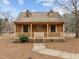 Charming two-story home featuring a inviting front porch, dormer windows and a landscaped yard at 582 Pollyanna Rd, Henderson, NC 27537
