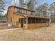 This home has a spacious screened in porch with a matching wood exterior and small pet entrance at 582 Pollyanna Rd, Henderson, NC 27537
