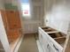 Unfinished bathroom featuring a tub shower and cabinets at 60 Valebrook Ct, Youngsville, NC 27596
