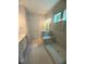 Modern bathroom featuring a glass shower, large vanity, and neutral tile at 60 Valebrook Ct, Youngsville, NC 27596