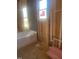 Bathroom under construction featuring a white bathtub and plumbing ready for fixtures at 60 Valebrook Ct, Youngsville, NC 27596