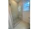 Modern bathroom featuring a glass shower, tiled walls, and neutral tile at 60 Valebrook Ct, Youngsville, NC 27596