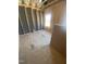Bedroom under construction, showcasing framing, a window, and wood flooring at 60 Valebrook Ct, Youngsville, NC 27596