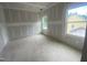 A bright bedroom under construction with newly installed windows bringing in natural light at 60 Valebrook Ct, Youngsville, NC 27596