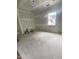 Spacious bonus room under construction featuring a large window that fills the space with light at 60 Valebrook Ct, Youngsville, NC 27596