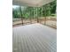 Screened-in back porch showing a wooden floor with natural surrounding view at 60 Valebrook Ct, Youngsville, NC 27596