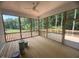Spacious screened-in porch with wood flooring and scenic views at 60 Valebrook Ct, Youngsville, NC 27596