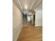 Welcoming entryway with hardwood floors, wainscoting, and a staircase leading to the upper level at 60 Valebrook Ct, Youngsville, NC 27596