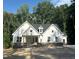 Charming new construction home featuring board and batten siding and a classic front porch at 60 Valebrook Ct, Youngsville, NC 27596