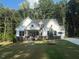 New construction home featuring white siding, dark trim, and a well-manicured lawn at 60 Valebrook Ct, Youngsville, NC 27596