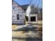 Image shows the garage area of the house under construction, with a view of the exterior and the surrounding area at 60 Valebrook Ct, Youngsville, NC 27596