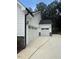 Three car garage with white doors and siding at 60 Valebrook Ct, Youngsville, NC 27596