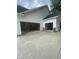 Spacious three-car garage, perfect for storing vehicles and outdoor equipment at 60 Valebrook Ct, Youngsville, NC 27596