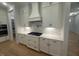 Modern kitchen featuring white cabinets, stainless steel appliances, and hardwood floors at 60 Valebrook Ct, Youngsville, NC 27596
