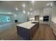 Spacious kitchen with a large center island, stainless steel appliances, and custom cabinetry at 60 Valebrook Ct, Youngsville, NC 27596