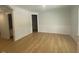 Spacious living room with hardwood floors, wainscoting, and ample natural light at 60 Valebrook Ct, Youngsville, NC 27596