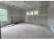 Expansive living room under construction with ample natural light from multiple windows at 60 Valebrook Ct, Youngsville, NC 27596