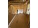 Framed living room with large windows showing view to outdoors at 60 Valebrook Ct, Youngsville, NC 27596